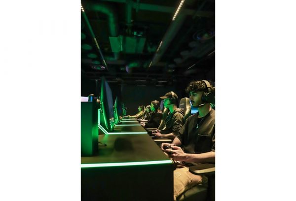 gamers with headsets at the Tournament Zone in London